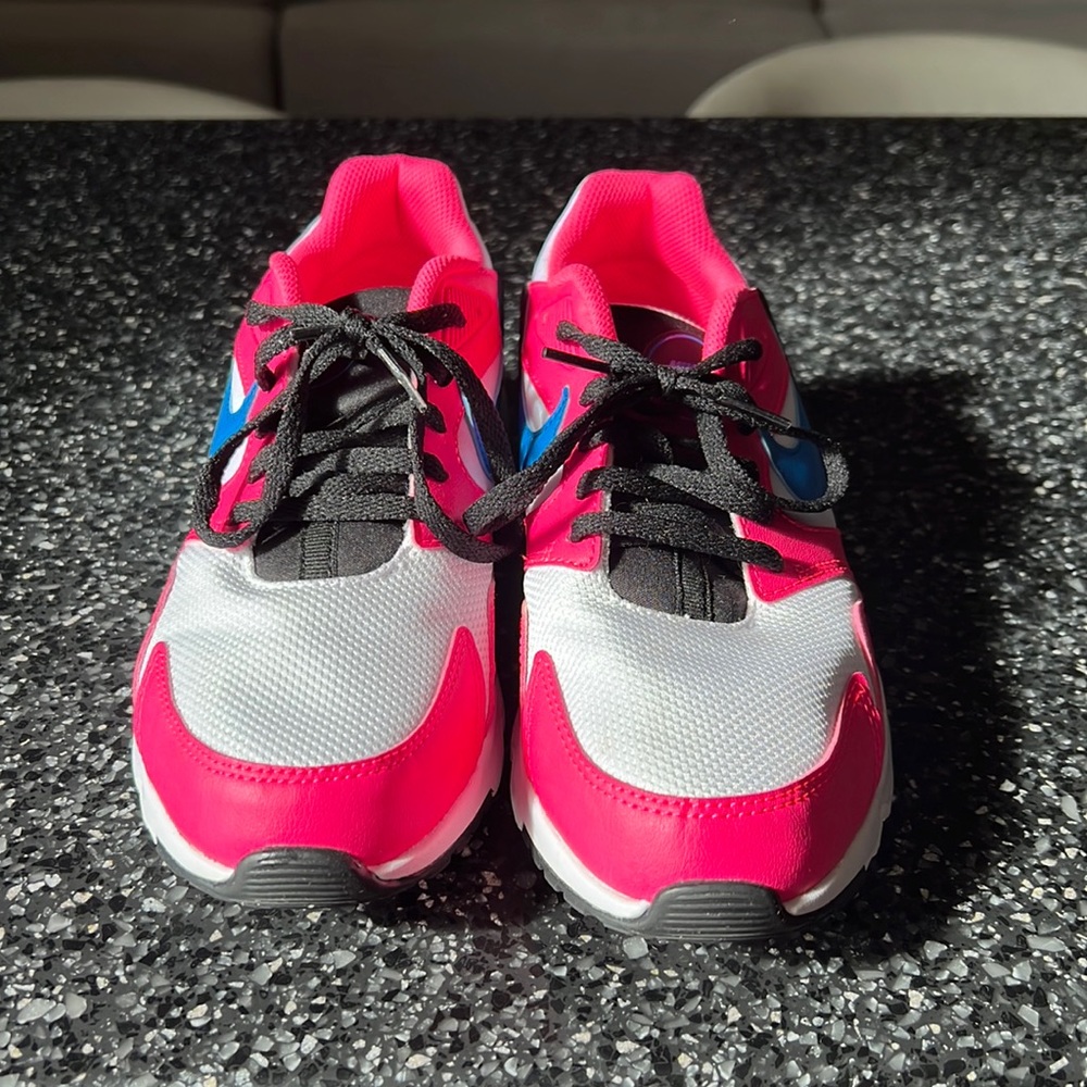 Nike tennis shoes hardly worn.   Like new.  Cute and bright